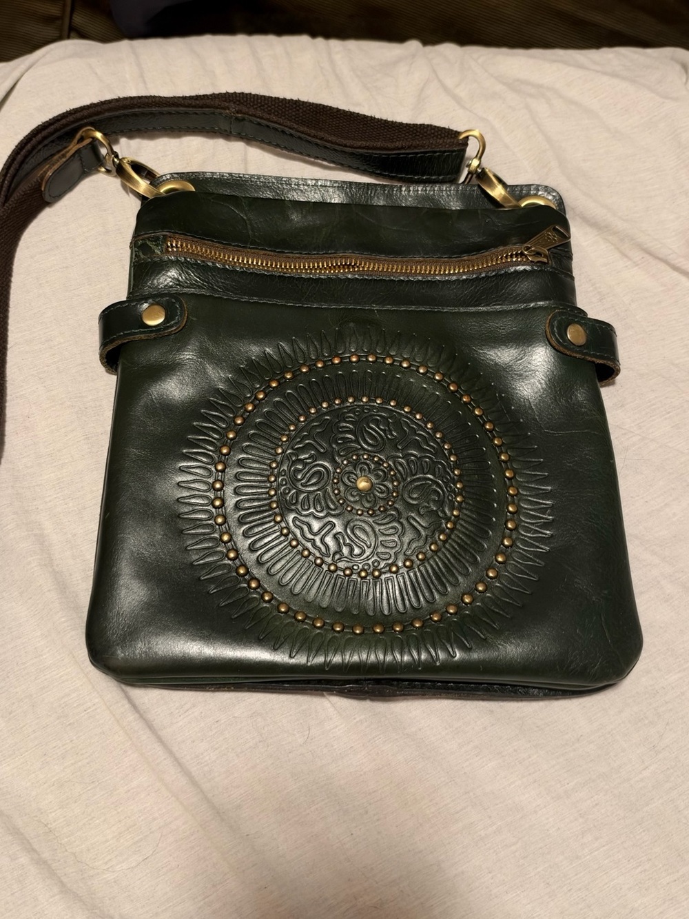 Dark Green Leather Crossbody Bag with Embossed Medallion